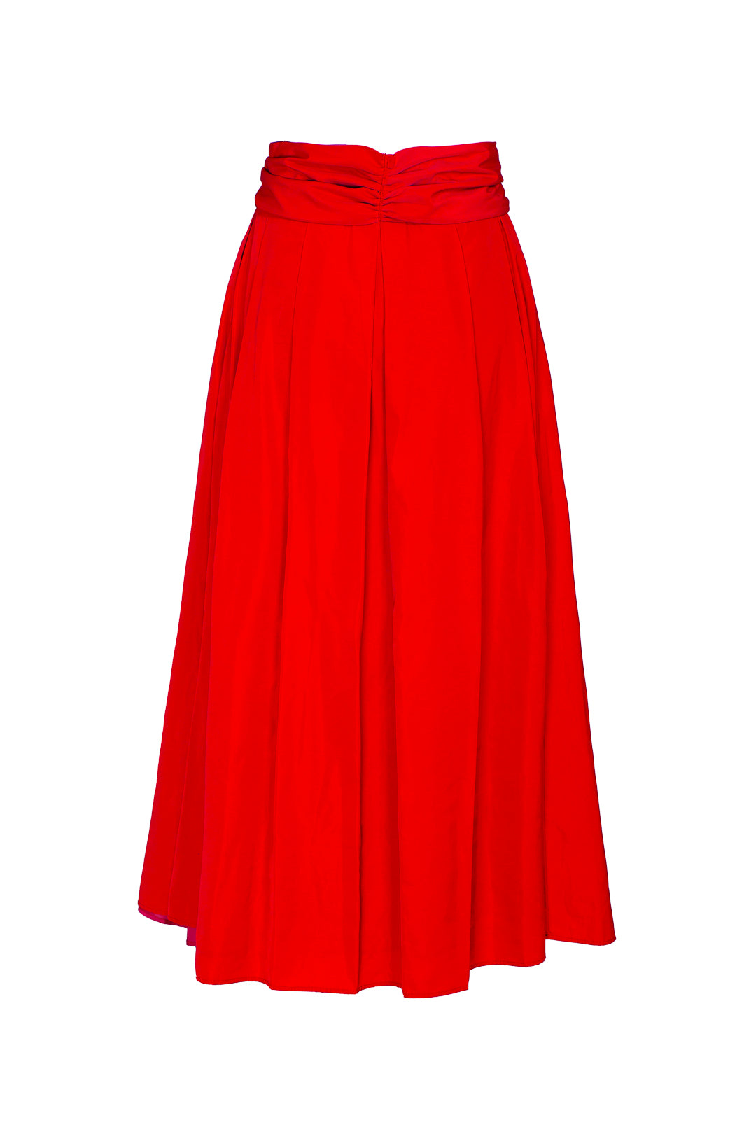 Falda midi roja estructurada con volumen teatral, corte evasé y gran lazo sastre lateral. Alta costura, exclusividad y diseño artesanal hecho en España.