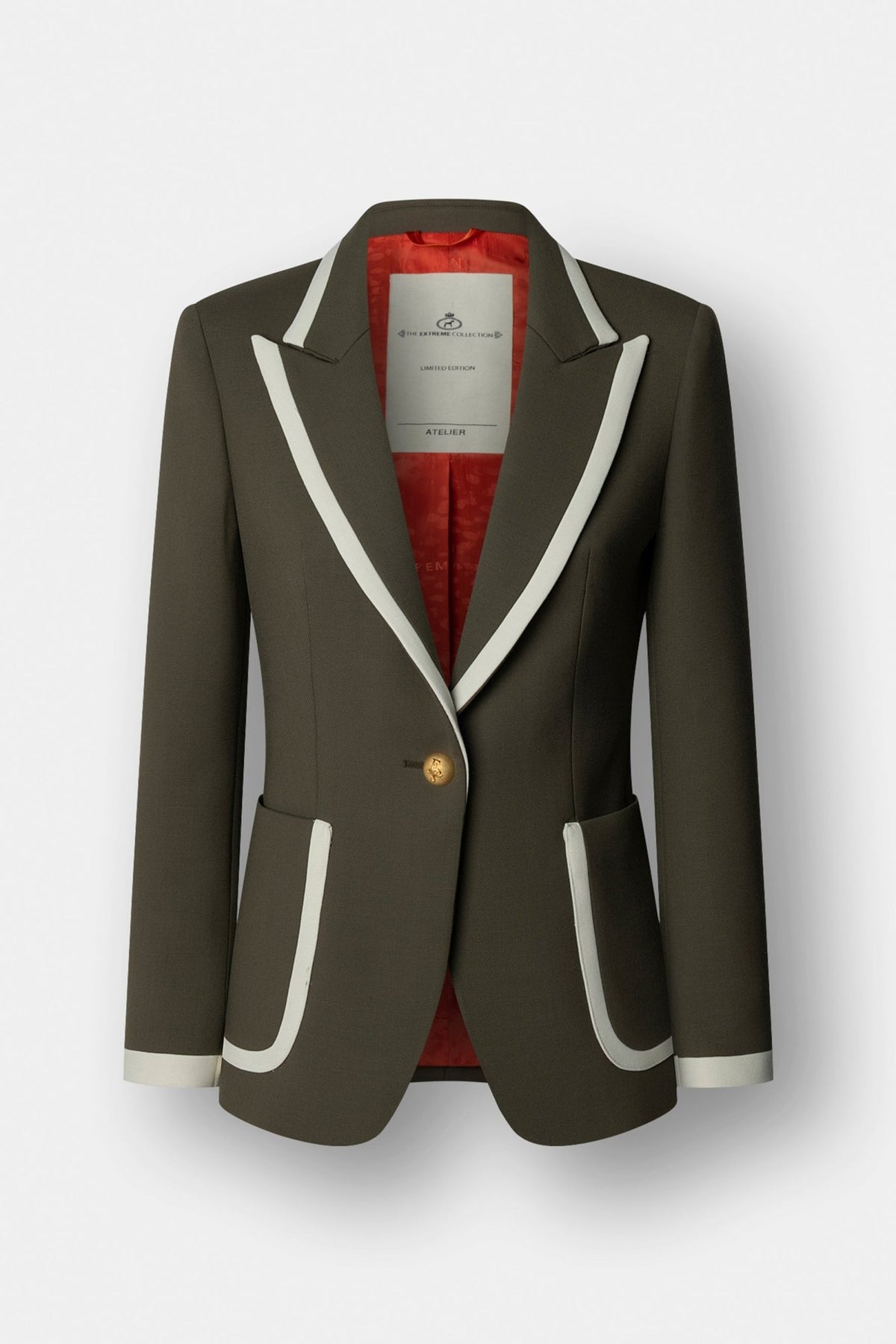 Blazer verde con ribetes en contraste Laurent de The Extreme Collection con diseño sastre, detalles dorados y exclusivos botones de autor.