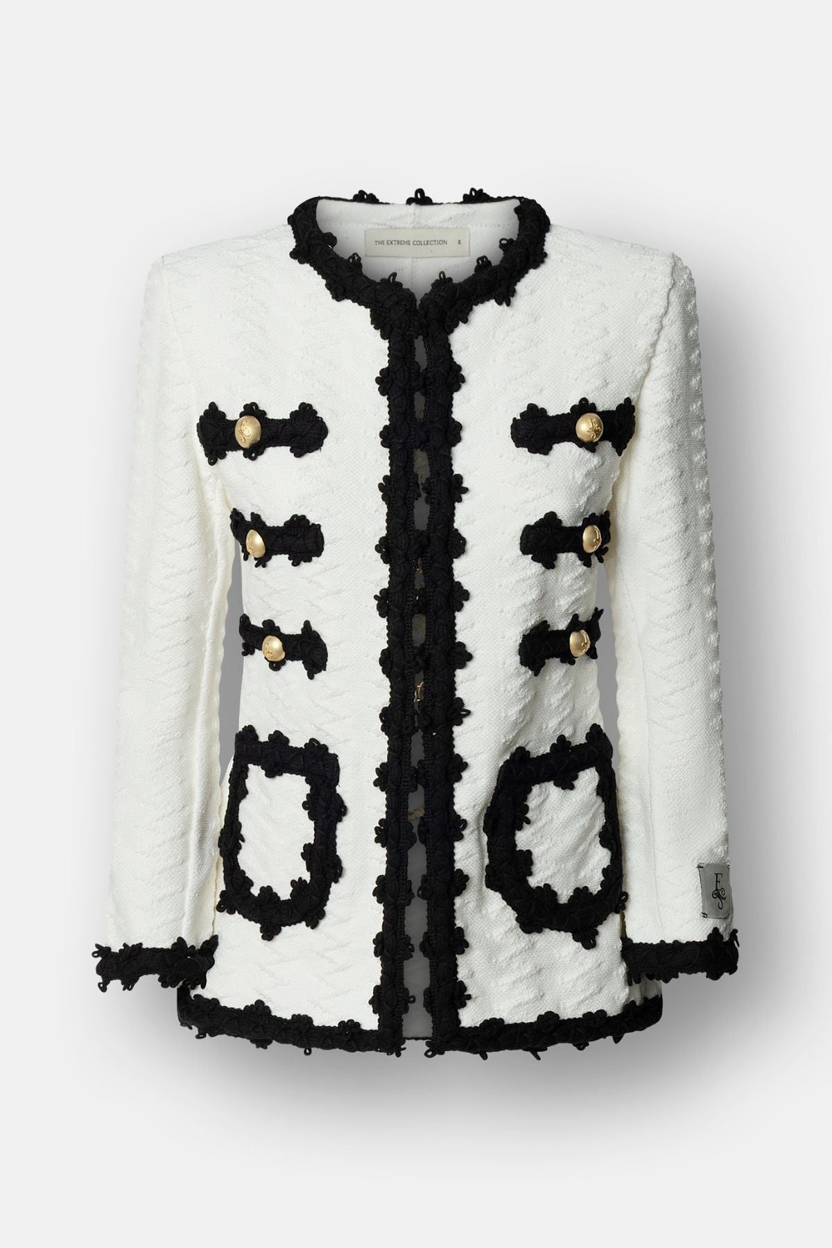 Chaqueta de punto para mujer modelo Oliver en blanco con vivos y bolsillos en negro.